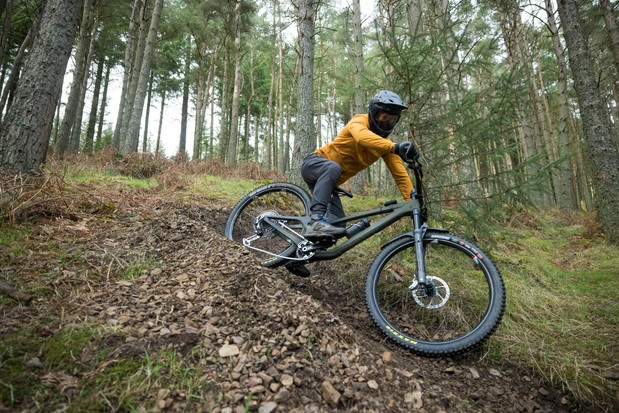 Male mountain biker Alex Evans riding a We Are One Arrival 152 enduro mountain bike fitted with SRAM's XX T-Type Eagle Transmission Powermeter AXS groupset